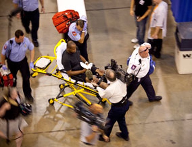 Filming a patient on a stretcher at the free clinic