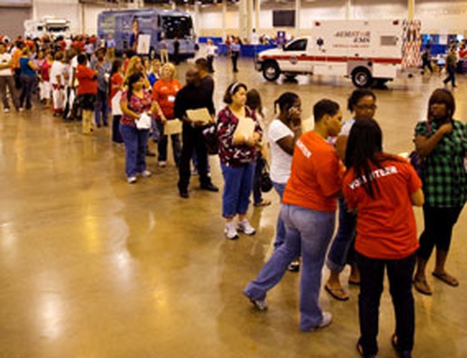 Uninsured Texas residents stand in line at the free clinic
