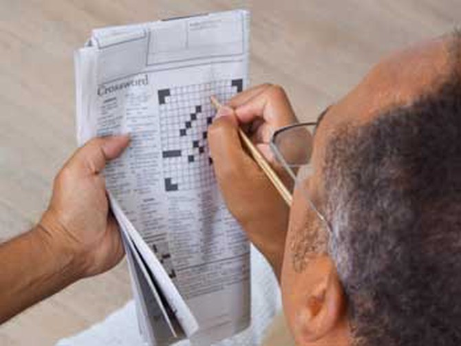 Man doing a crossword puzzle