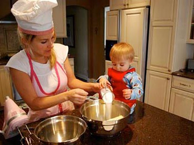 Maria and her son bake cookies.