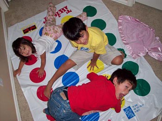 Laura's kids play Twister.