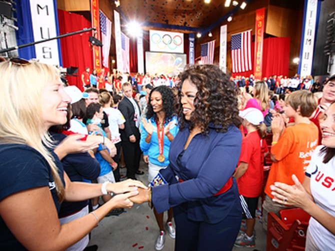 Oprah greets fans.