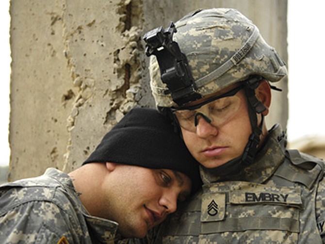 A quiet moment between soldiers
