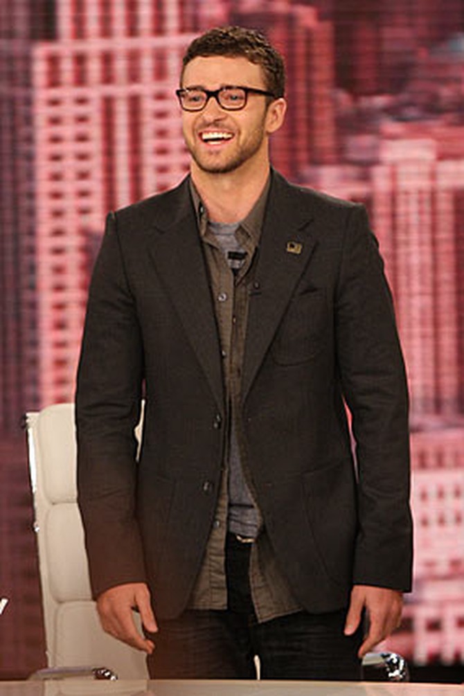Justin Timberlake is wearing William Rast Ben jeans with a New America T-shirt and blazer.