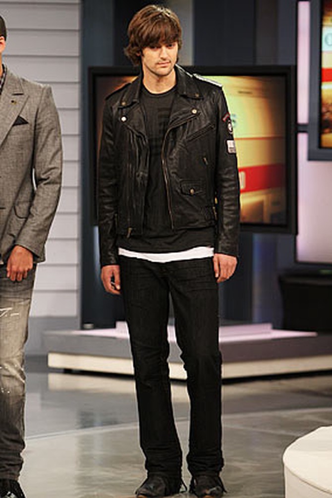 A man models Ben jeans with a William Rast leather jacket.