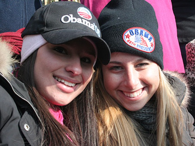 Two girls dressed in Obama hats