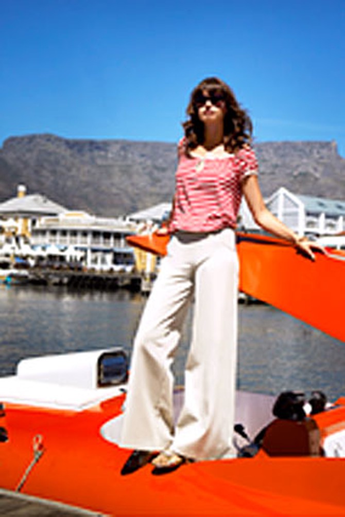 Model on an adrenalin speed boat in Cape Town