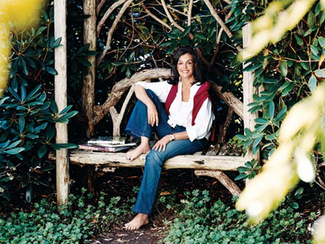 Dianne Wallace sitting in her garden