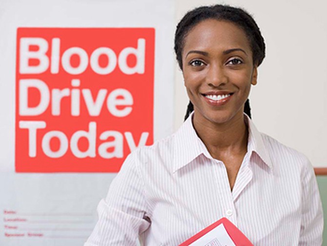 Woman volunteering at blood drive