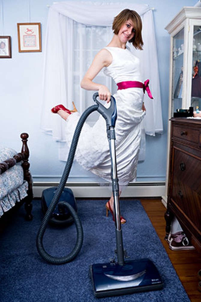 Vacuuming in a gown