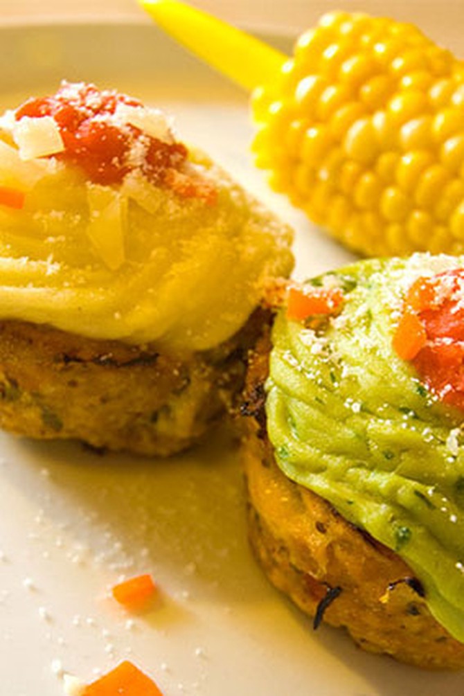 Small meatloaves topped with mashed potatoes and guacamole