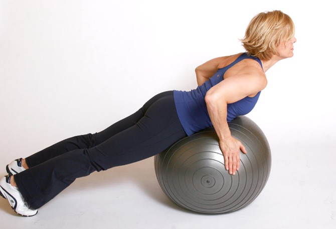 Andrea Metcalf demonstrates the back extension exercise.