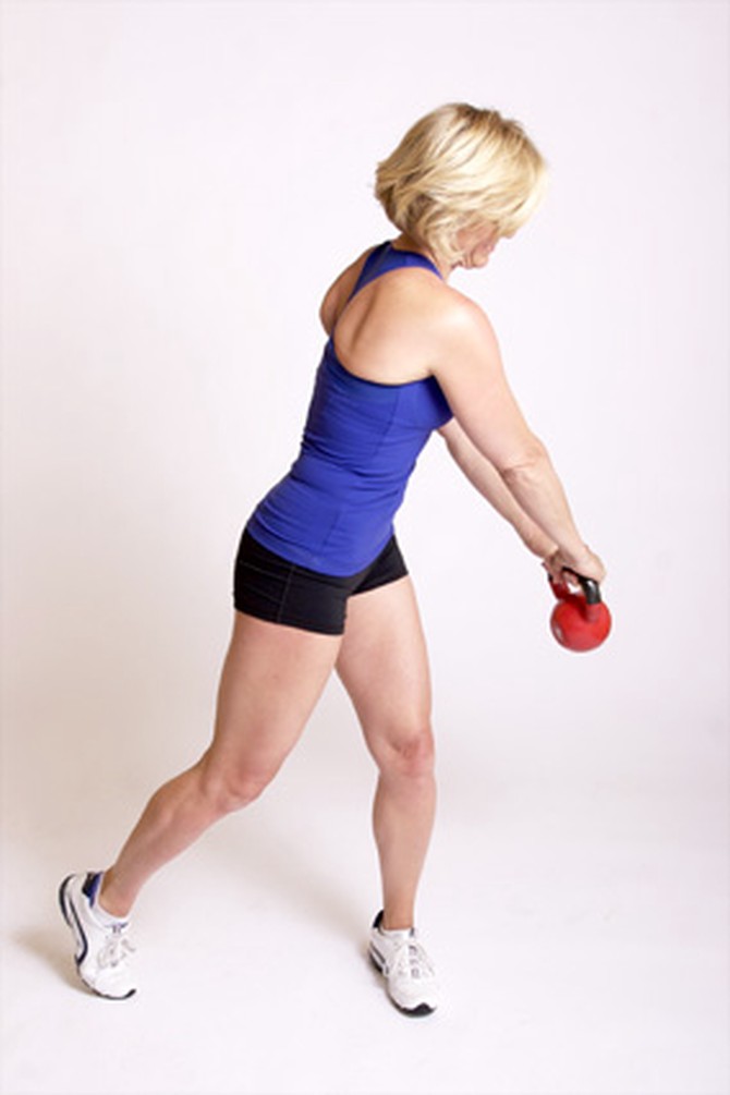 Andrea Metcalf demonstrates how to do the diagonal swing exercise using a kettlebell.