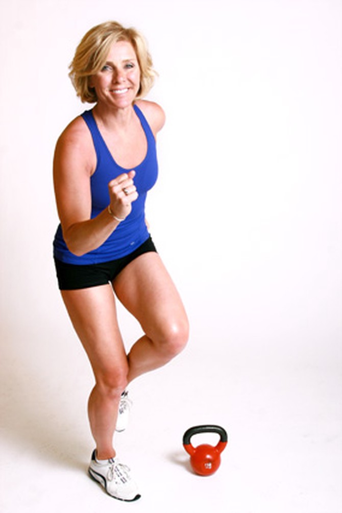 Andrea Metcalf demonstrates how to do the power hop exercise using a kettlebell.
