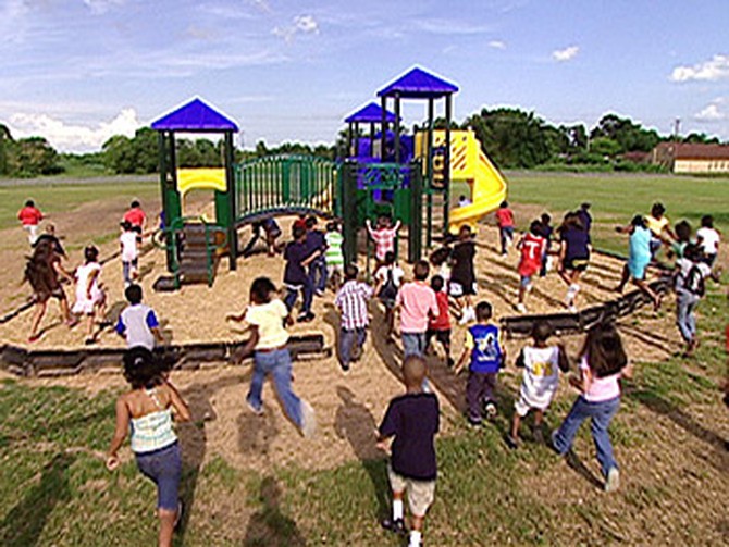 The Simms Elementary students rush the playground