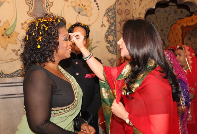 Princess Diya Kumari greets Oprah Winfrey inside the spectacular palace