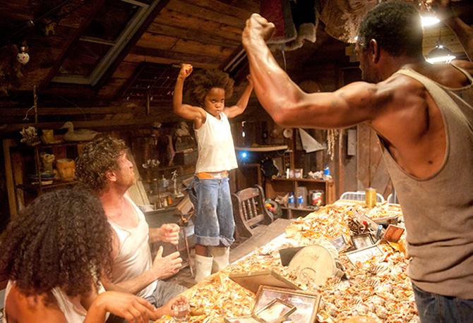 Dwight Henry and Quvenzhane Wallis flexing their arms in Beasts of the Southern Wild