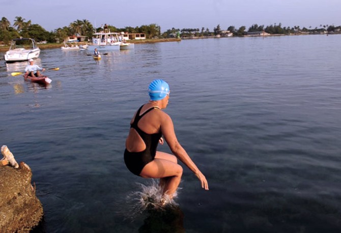 Diana Nyad jumps into the water at Ernest Hemingway Nautical Club in Havana