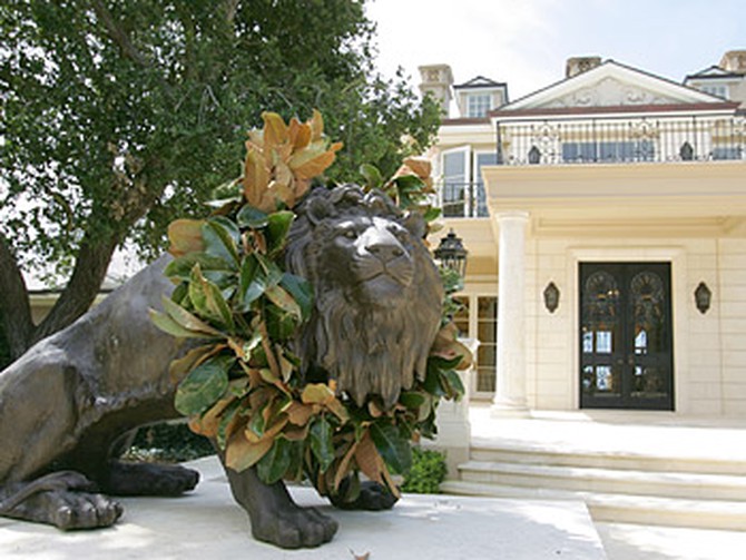 A lion statue welcomes guests to Promised Land.