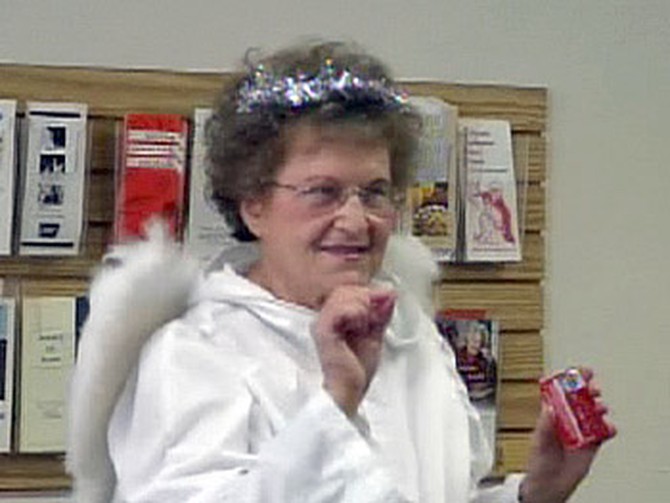 Phyllis Mroczek dresses as one of 'Oprah's Angels' to help the elderly.