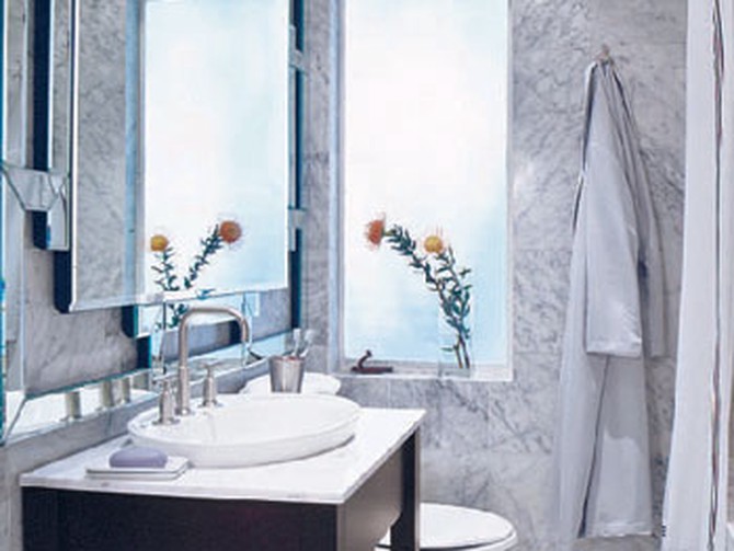 A mirror instantly enlarges a small bathroom.