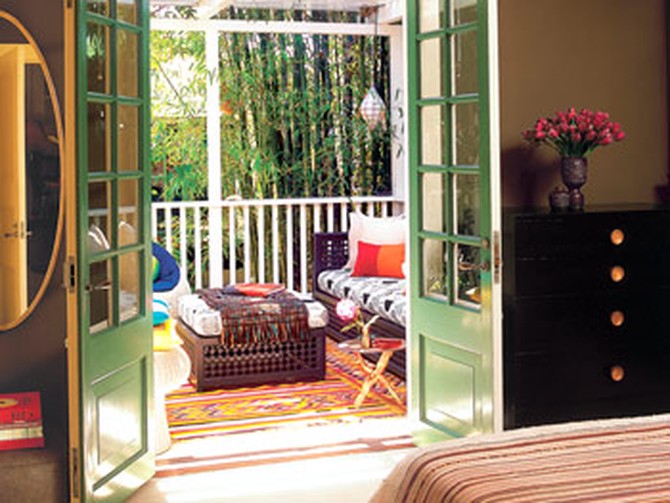 French doors allow for a bedroom that is open and intimate at the same time.