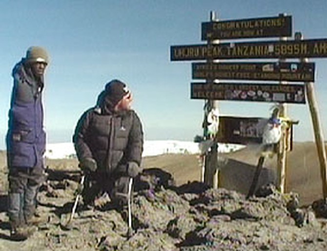 Warren at the summit of Mount Kilimanjaro