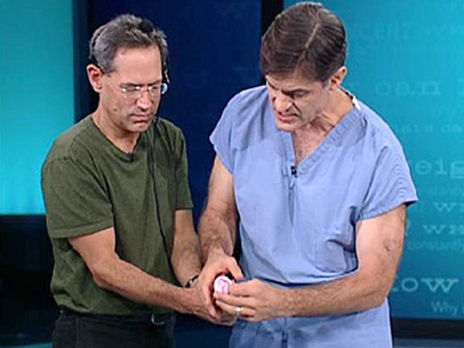 Dr. Oz demonstrates how to wash an uncircumcised penis.