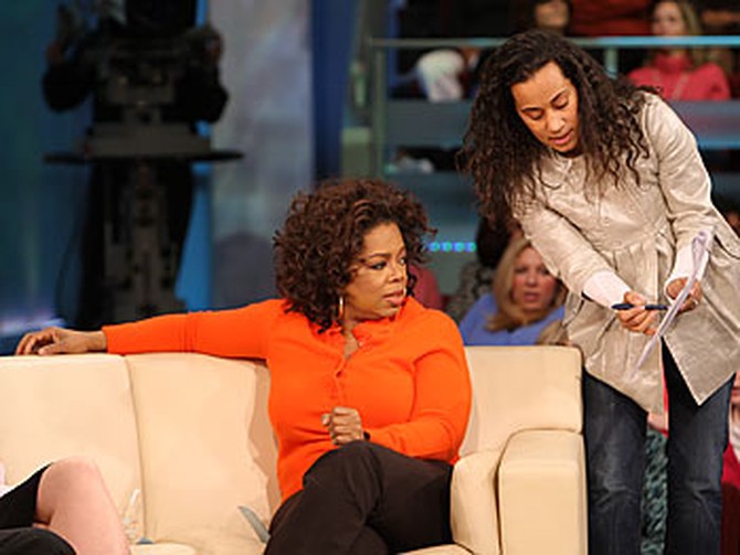 During a break in taping, 'Oprah Show' producer Andrea comes onstage to discuss the show plan.