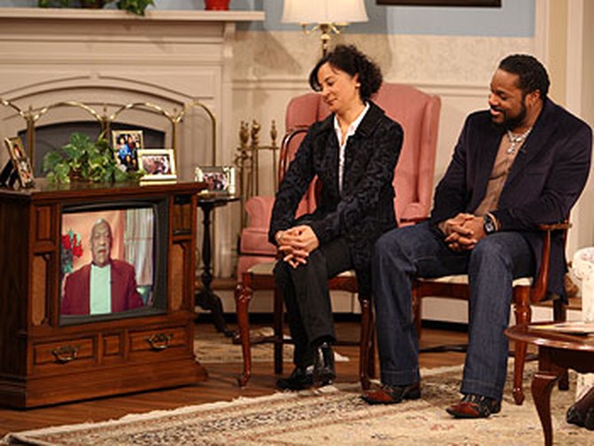 Sabrina Le Beauf and Malcolm-Jamal Warner watch an interview with their TV dad.