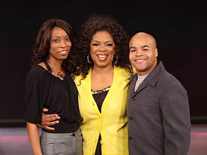 Angelo poses for a photo with Oprah.