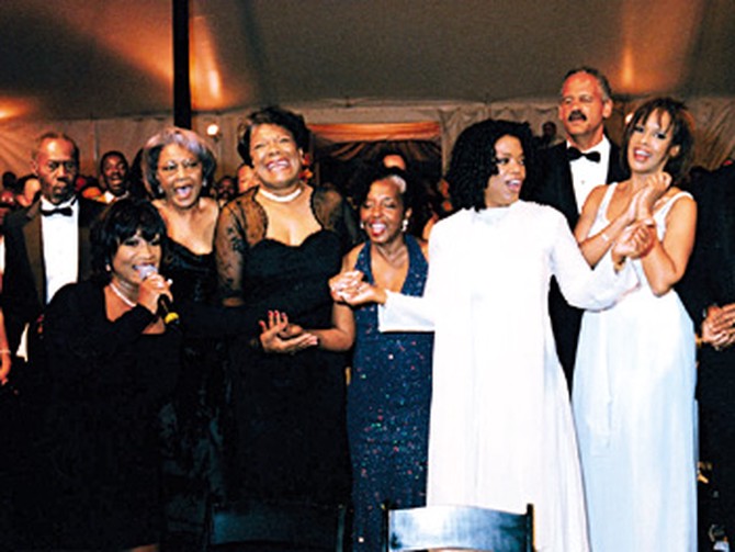 Maya Angelou (center) is serenaded by (from far left) Patti Labelle, Nancy Wilson, Rosa Johnson, Oprah, Stedman, and Gayle
