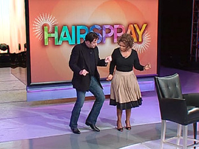 John shows Oprah the dance moves he used in 'Hairspray.'