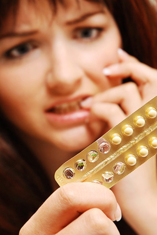Woman with birth control pills