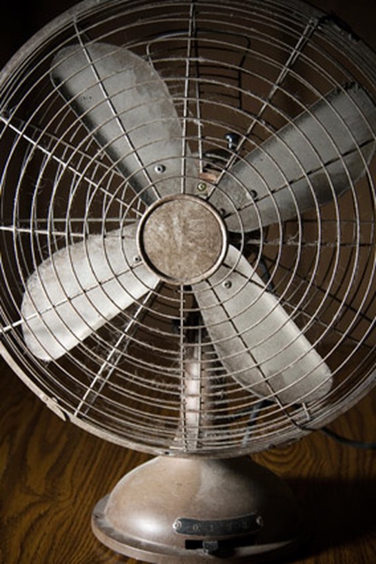 Old fan covered in dust