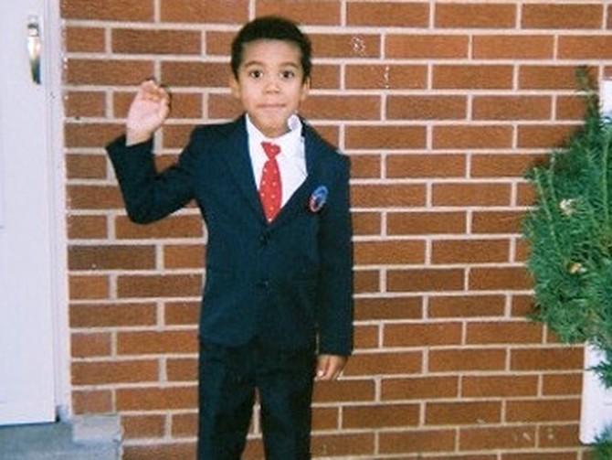 Little boy dressed as President Barack Obama