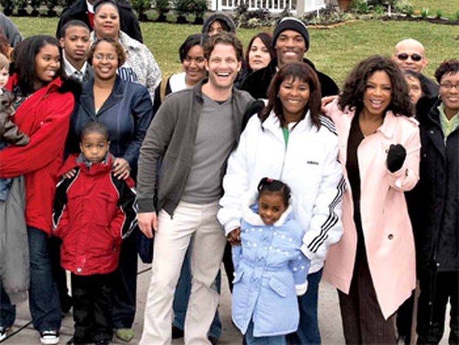 Oprah and Nate celebrate with the families who received new homes.