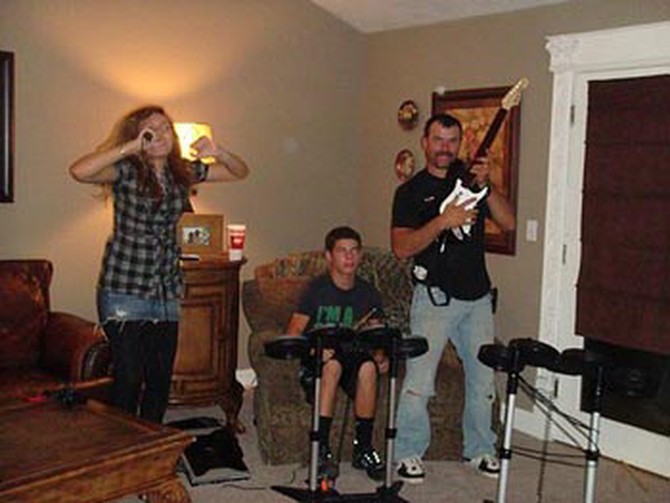 Brittini's family plays Rock Band.
