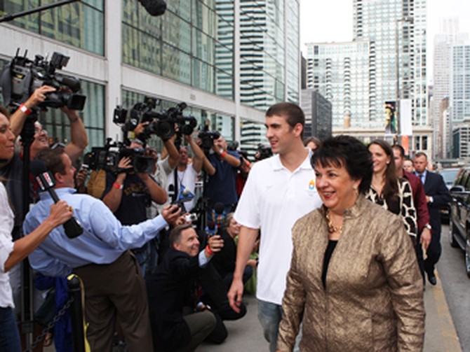 Michael Phelps and his mother, Debbie, greet the press line.