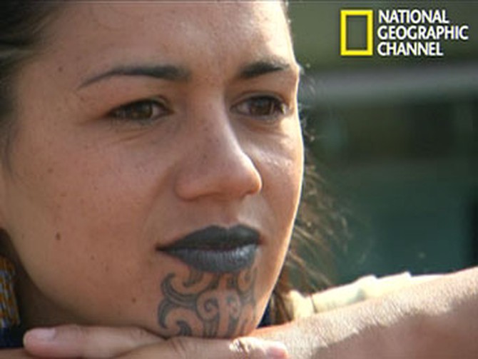 A Maori woman with tattooed lips