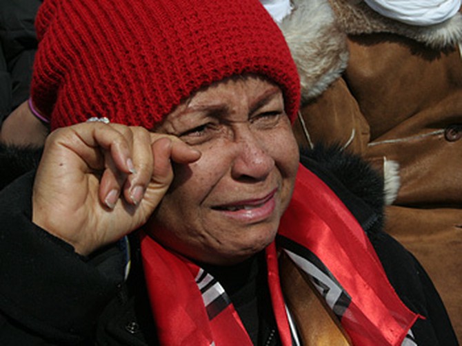 Woman wiping away tears