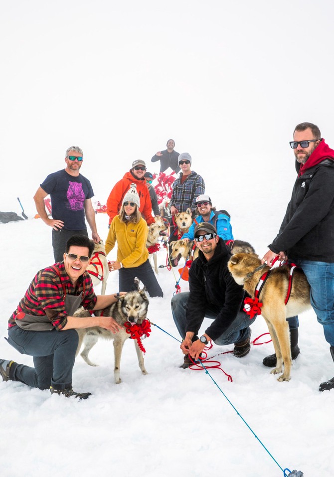 the crew posing with huskies