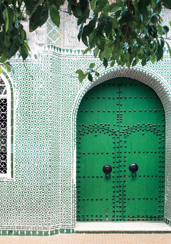 Studded green door in Chefchaouen, Morocco