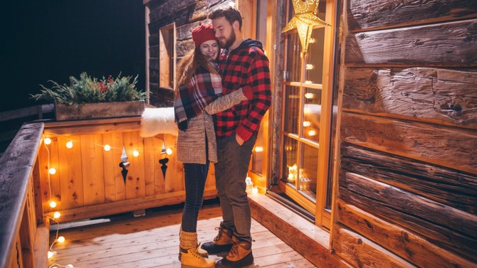 Couple enjoying cabin porch