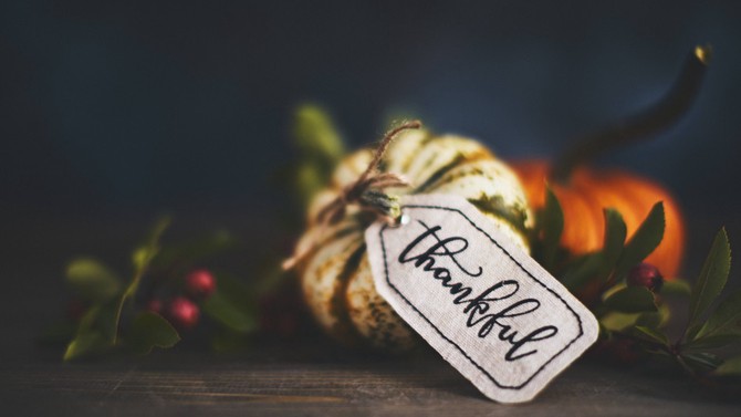 Mini pumpkin with 'thankful' tag