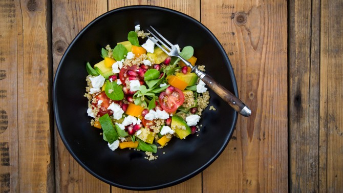 top view of a quinoa, tomato and goat cheese salad