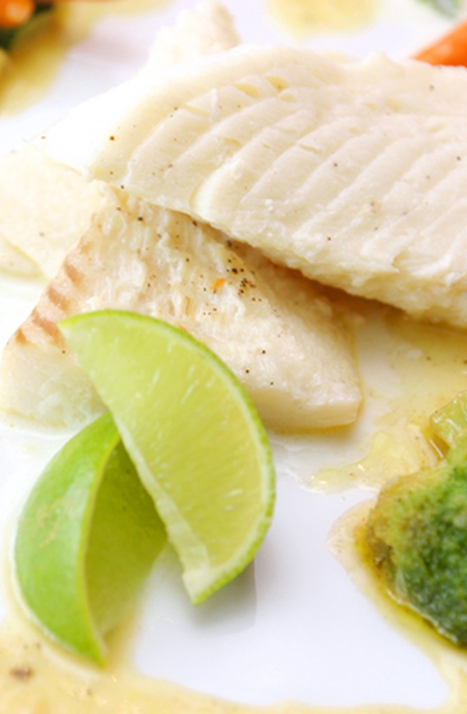 Tilapia with lime wedges