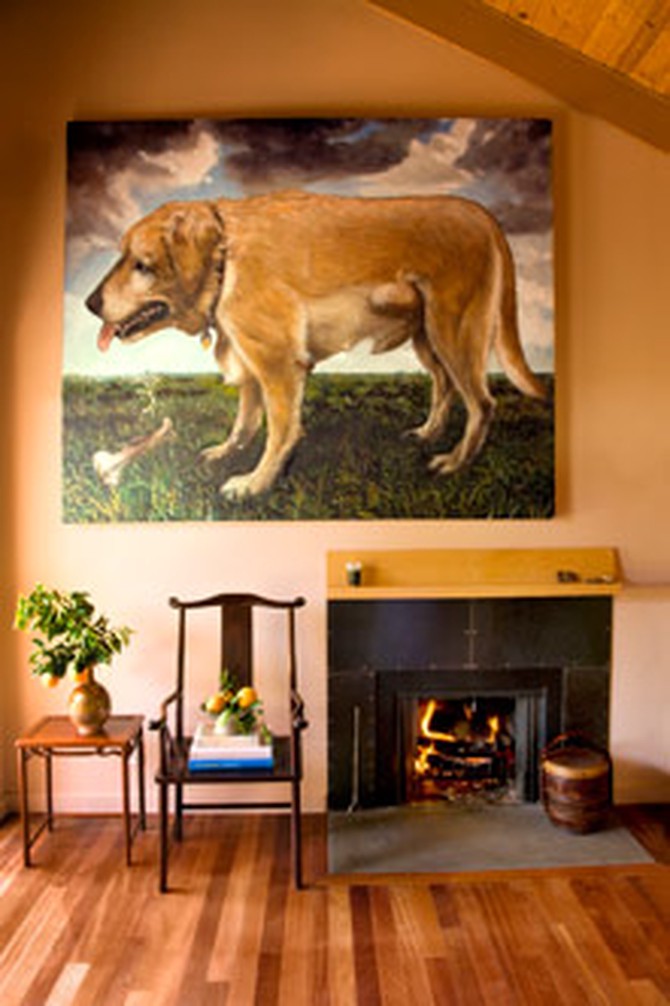 Dog painting, chairs, and fireplace