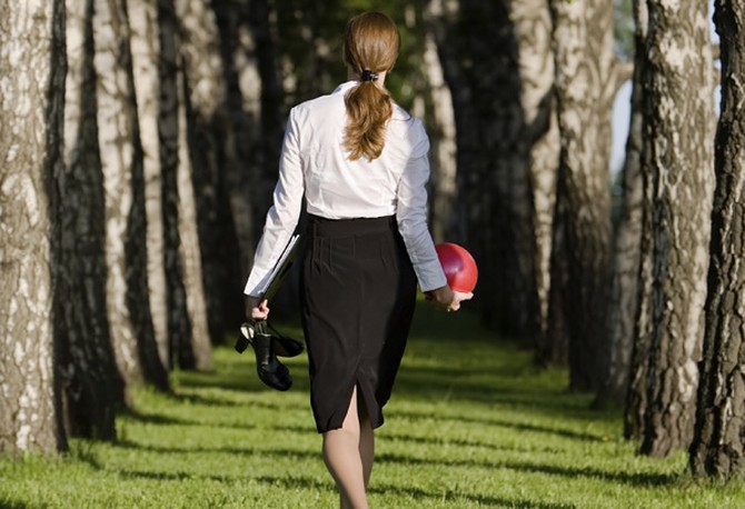 Woman walking in grass