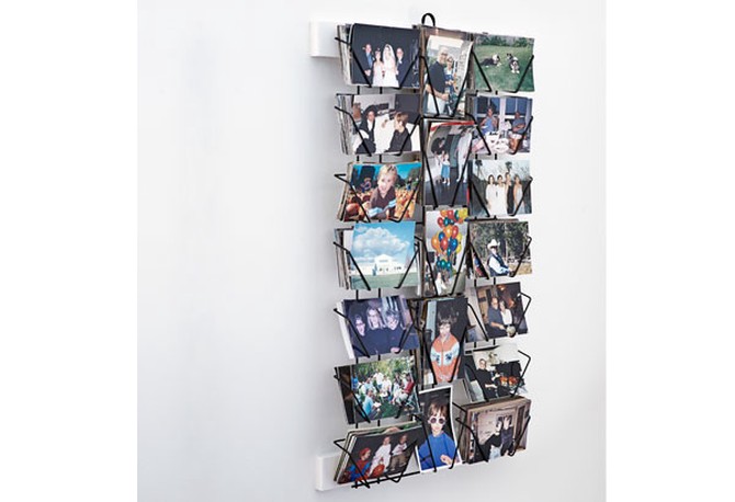 Photos displayed in postcard rack